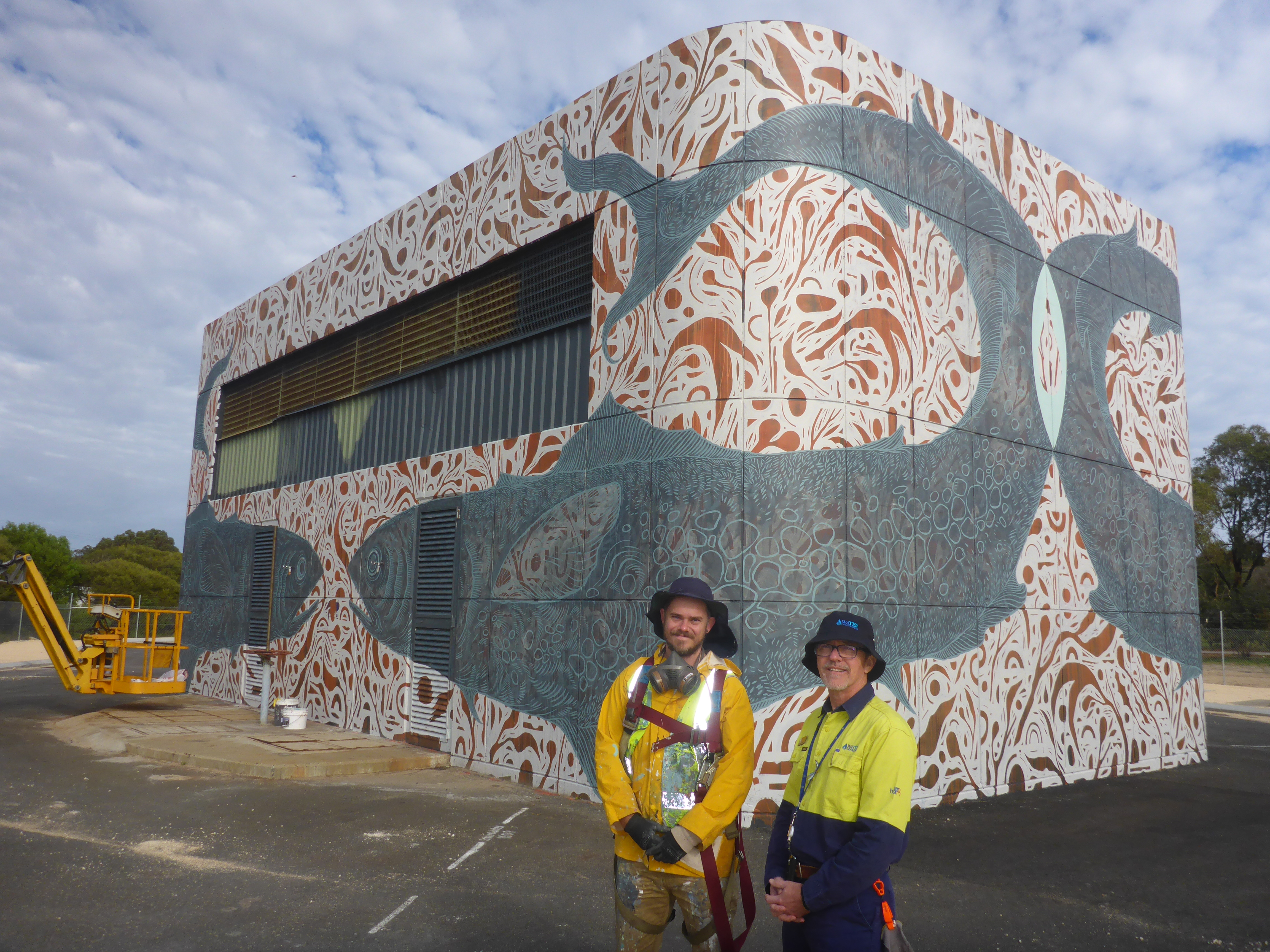 Water Corporation's regional manager John Janssen discusses theartwork on Bunbury’s Parade Road wastewater pump station with artist Andrew Frazer