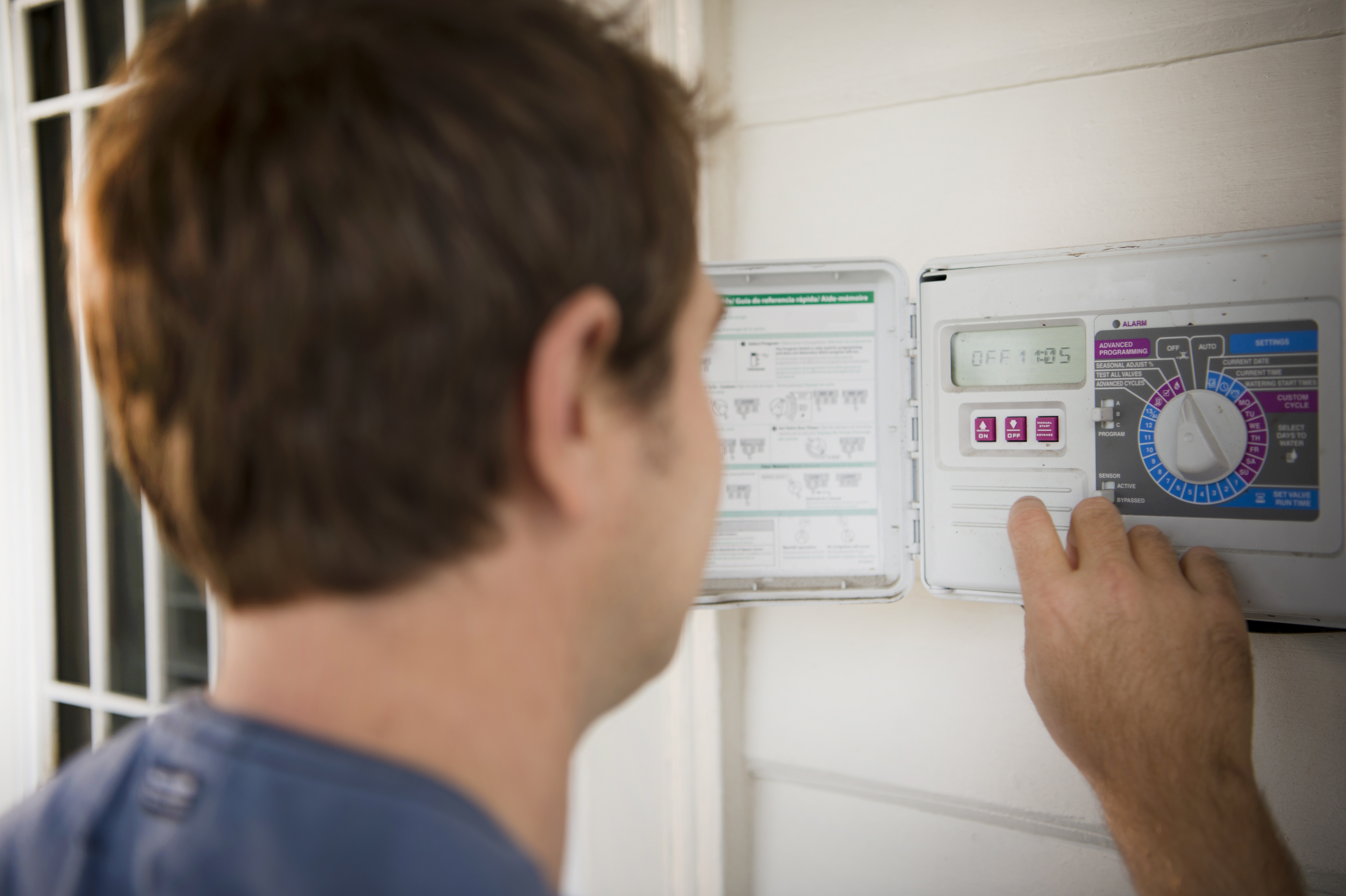 Man with irrigation controller